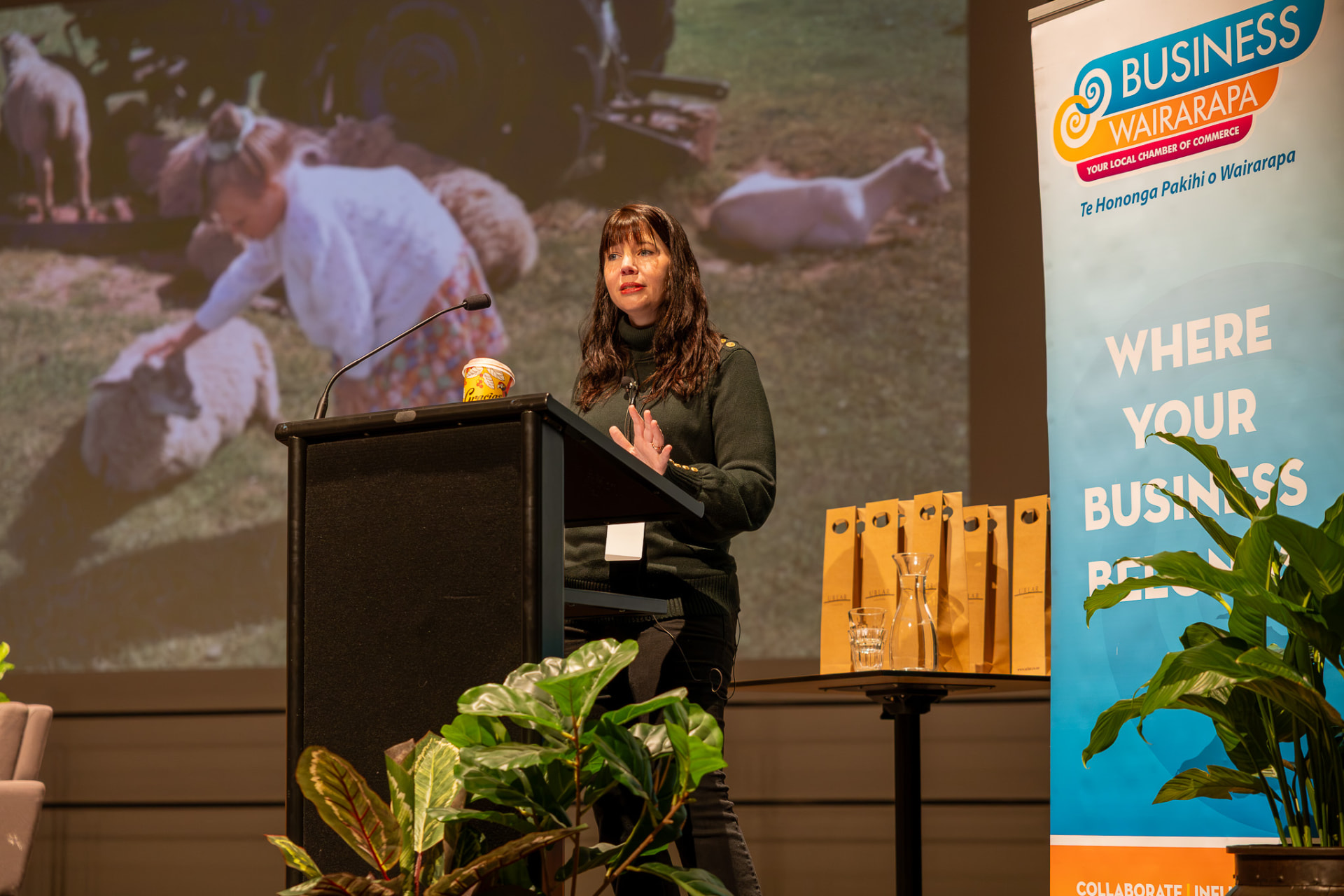 Brianne West speaking on stage